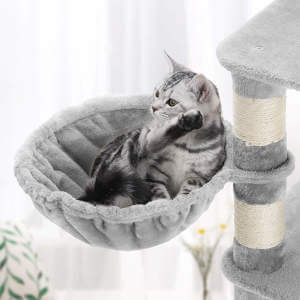 A super cozy plush cat hammock attached to a large, big cat friendly cat tree.