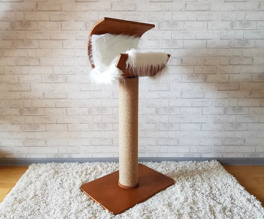 Another cat tree without carpet that is perfect for small apartments, especially if you only have on cat.  A central post covered in sisal and a big, cushy cat bed awaits on top.